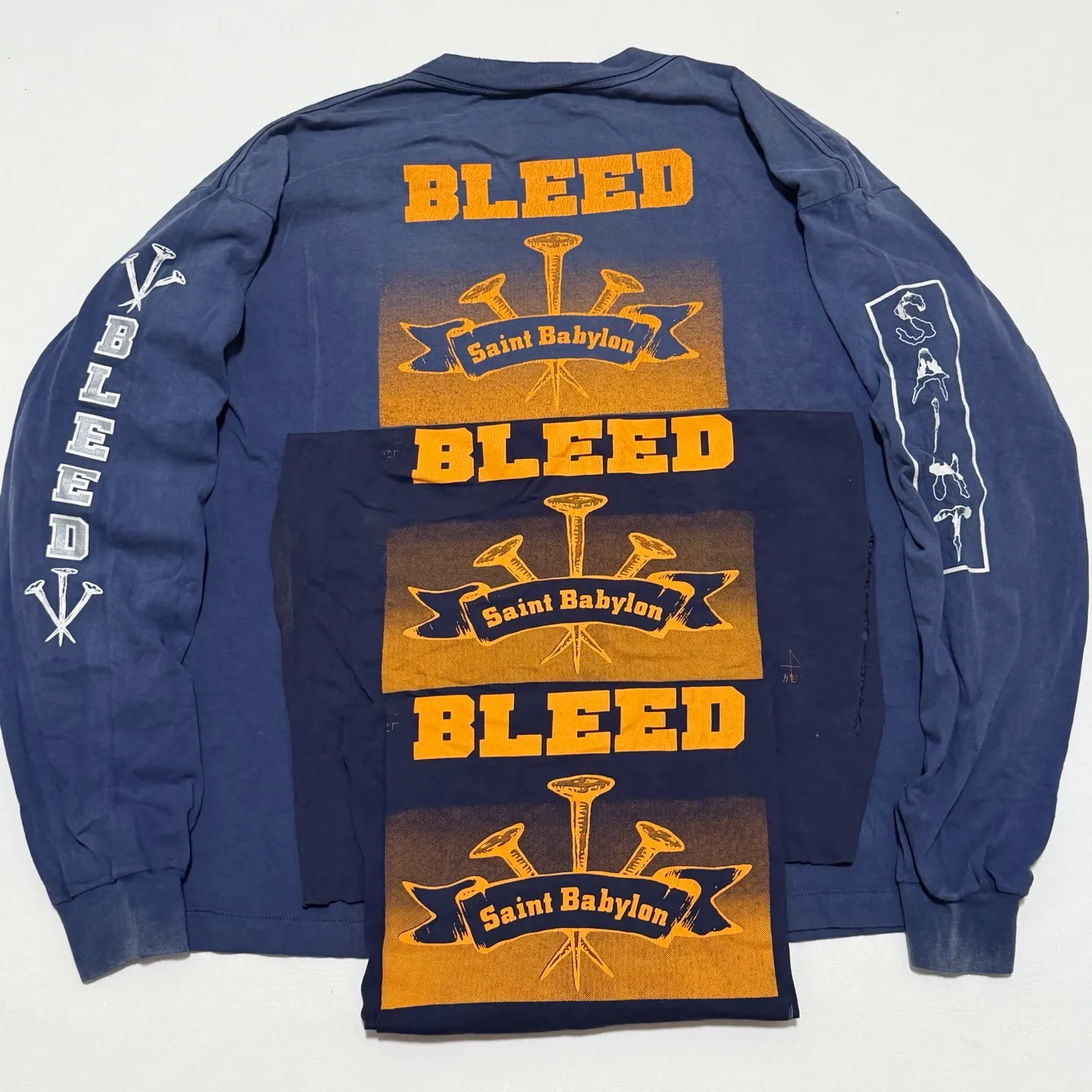 SAINT Mxxxxxx × BABYLON BBLN_LS TEE/SAINT BABYLON/NVY/BABYLON co-branded style Wolf head SAINT/nail distressed long sleeves Washed blue S-XL Completely matched Tube weaving fabric without side seams Garment dyeing Maliu water faded distressing Simulated sun fading treatment Natural fading Handmade holes and frayed Ink splashing treatment Correct main mark/wash mark/little angel anti-counterfeiting mark